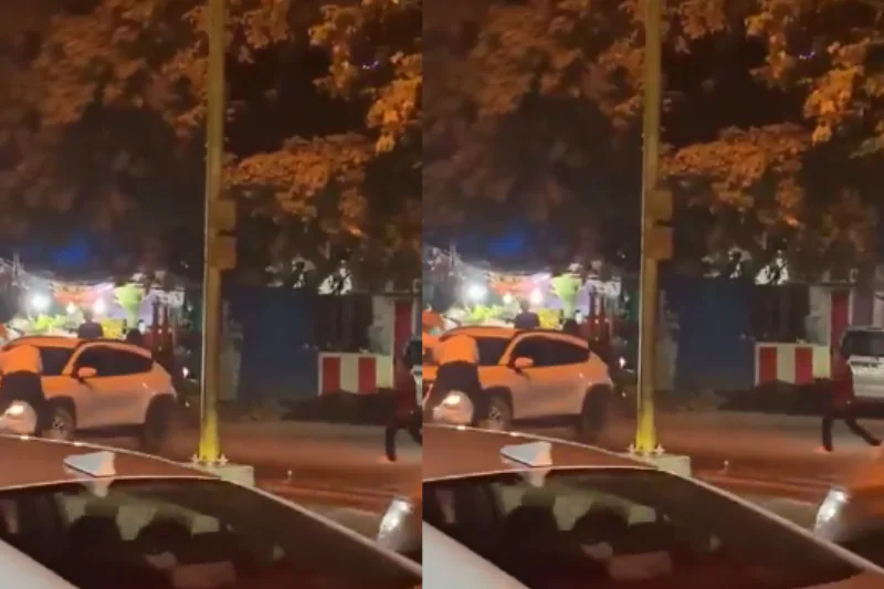 Unruly driver drags 2 traffic