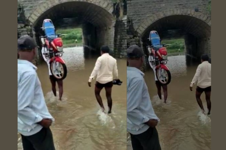 Bike rider carrying bike like 'Baahubali' in rayachuru the video of the bike rider's adventure has gone viral